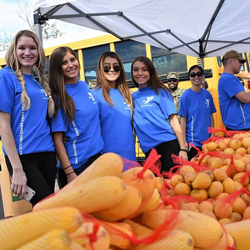 ASYMCA volunteers helping with a food distribution event